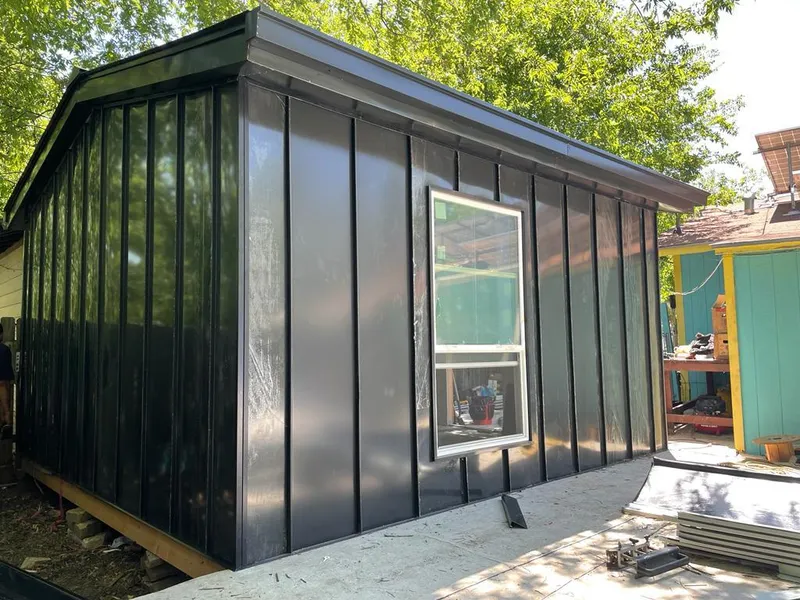 Black standing seam metal wall panels for Roof Inspection in White Oak
